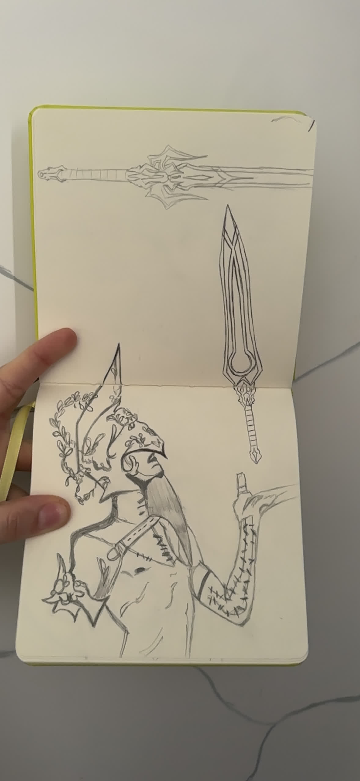 Pencil sketch of an armored knight in a laurel-crowned helmet raising a jagged sword, with two ornate swords beside.